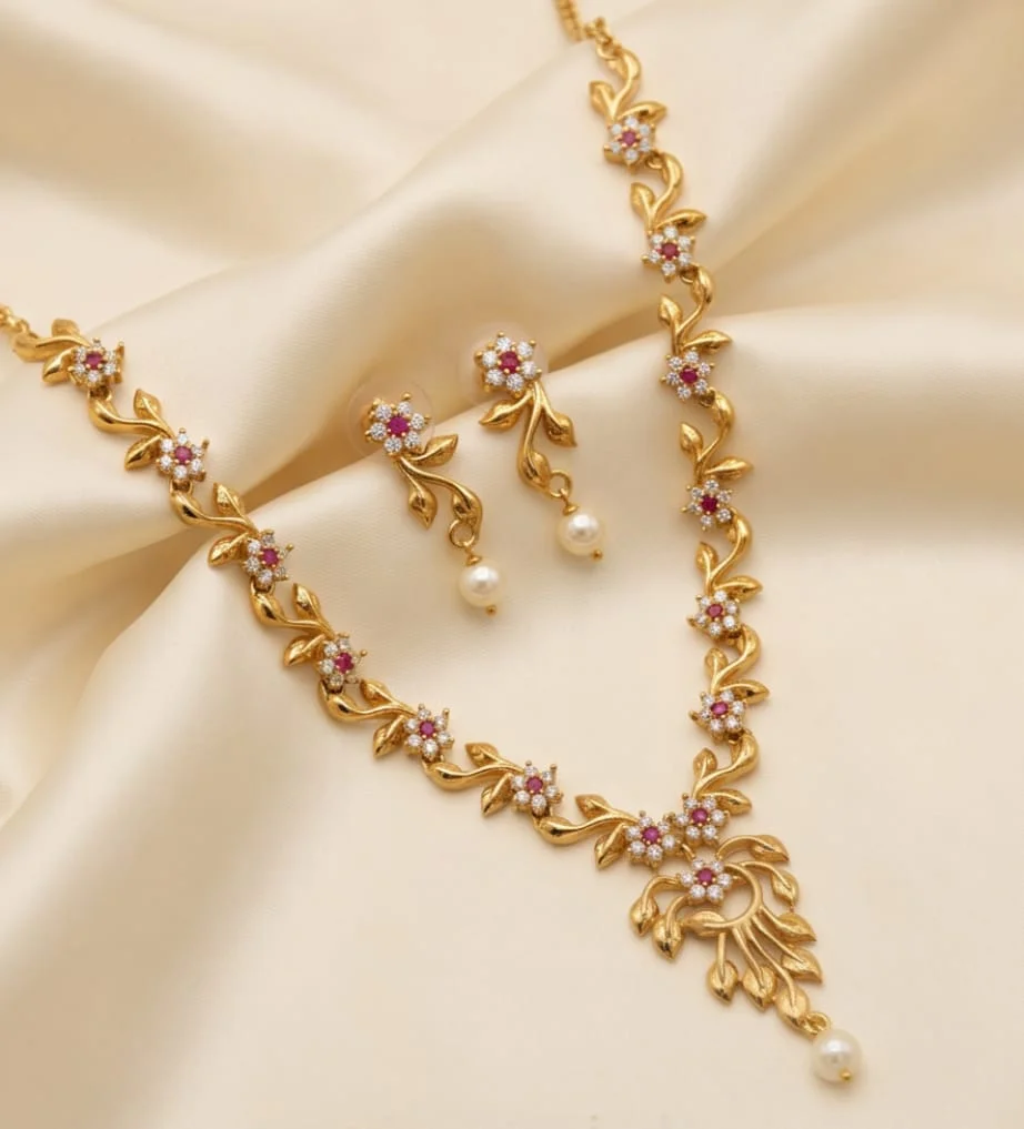 This Gold Plated AD And CZ Floral Leaf Necklace And Matching Pearl Drop Earring Set