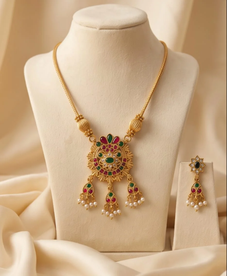 A South Indian Temple Jewellery Necklace Set Featuring An Antique Gold Toned Finish,