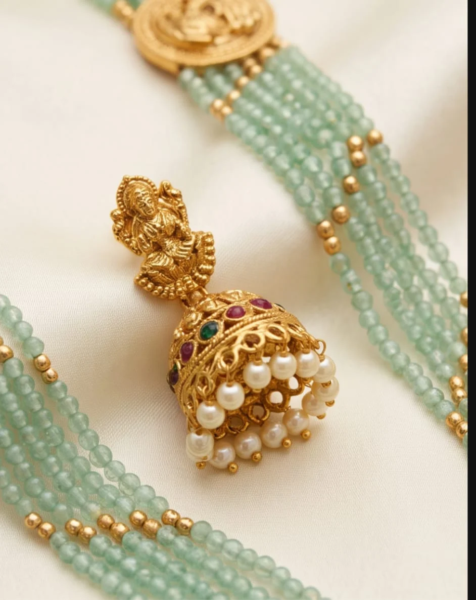 This Mint Green Beaded Traditional Temple Jewellery Set Features An Antique Gold Tone Goddess Lakshmi Pendant And Matching Pearl Accented Jumka Earrings. view 3