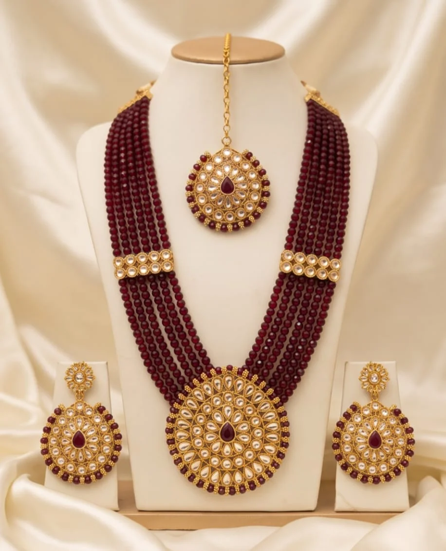 This Traditional Indian Deep Maroon Beaded Kundan Necklace And Earring Set Features Multi-Strand Maroon Bead Strings