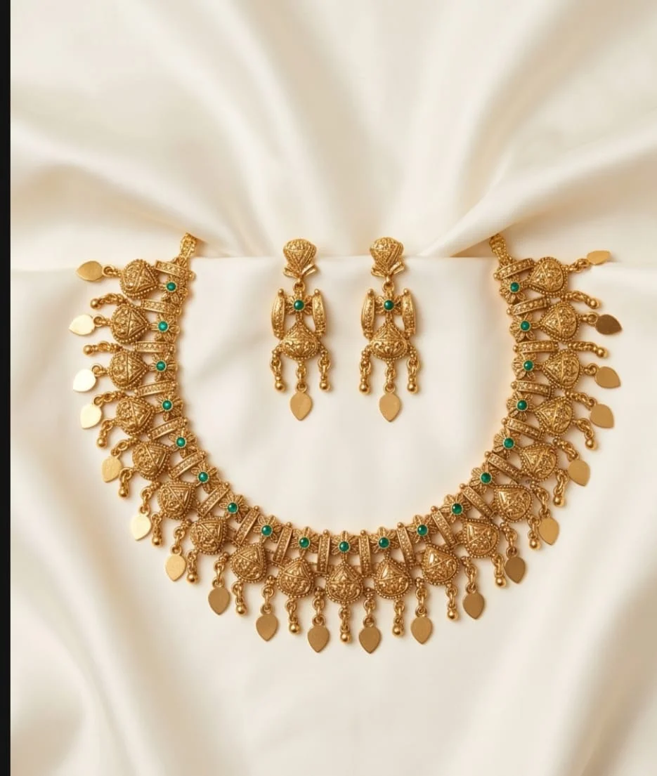 Beautiful Antique Gold Finish Inspired Elakathali Necklace Set With Intricate Detailing And Matching Earrings