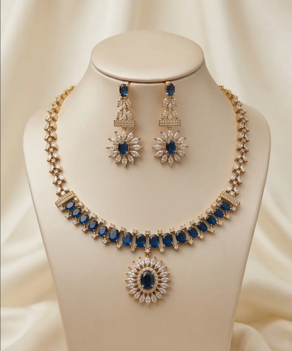 This Stunning Gold-Plated Necklace & Matching Earrings Set, Designed With Eye-Catching Blue Oval Stones