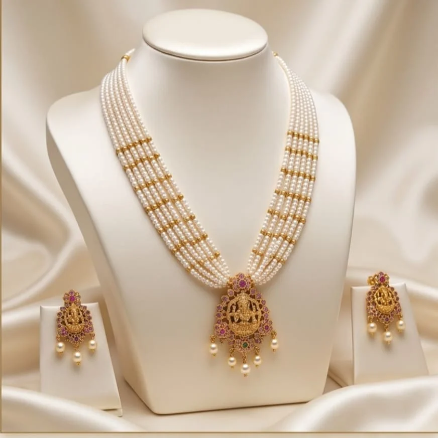 Ganesha Pearl Mala Features Multiple Strands Of Lustrous Pearls, Beautifully Finished With Gold Accents And An Intricate Lord Ganesha Pendant