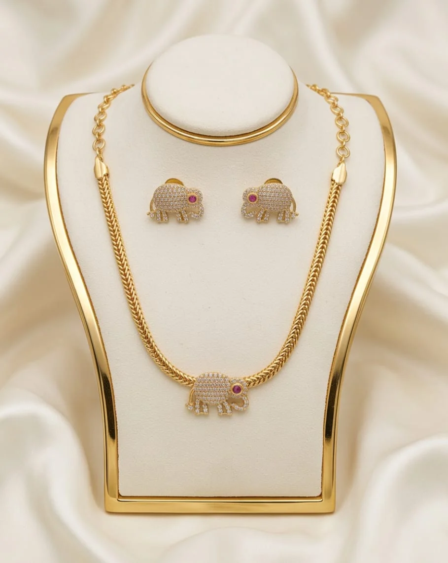 This Stunning Gold-Plated Elephant Motif Necklace Set, Beautifully Adorned With Sparkling CZ Stones And Matching Stud Earrings.  Perfect For Festive Occasions, Weddings, Traditional Functions & Special Celebrations A Timeless Blend O