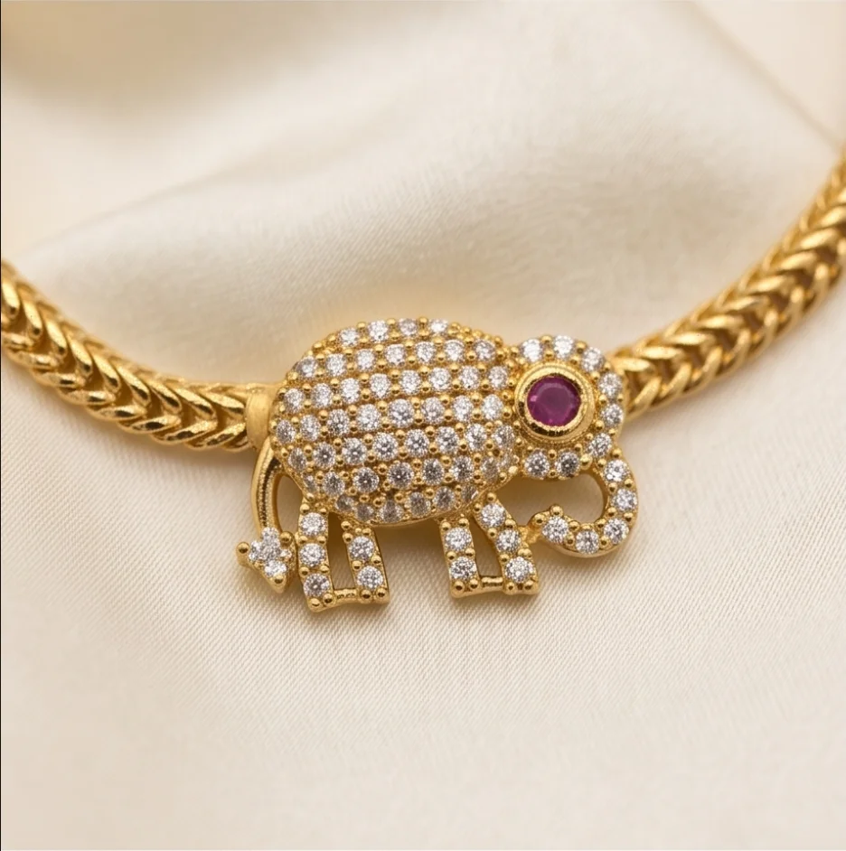 This Stunning Gold-Plated Elephant Motif Necklace Set, Beautifully Adorned With Sparkling CZ Stones And Matching Stud Earrings.  Perfect For Festive Occasions, Weddings, Traditional Functions & Special Celebrations A Timeless Blend O view 3