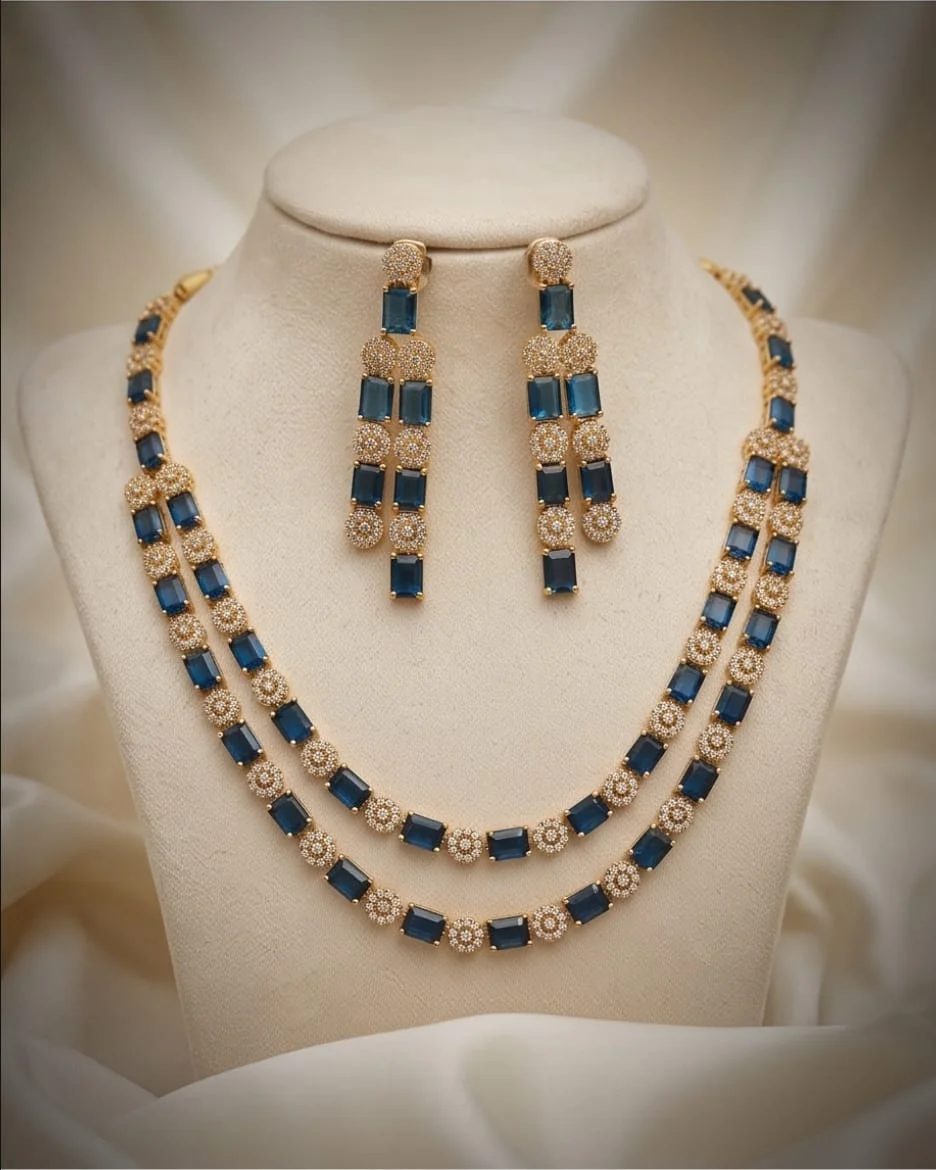 This Is A Gold-Plated Layered Necklace And Matching Earring Set Featuring Vibrant Emerald-Cut Navy Blue Stones