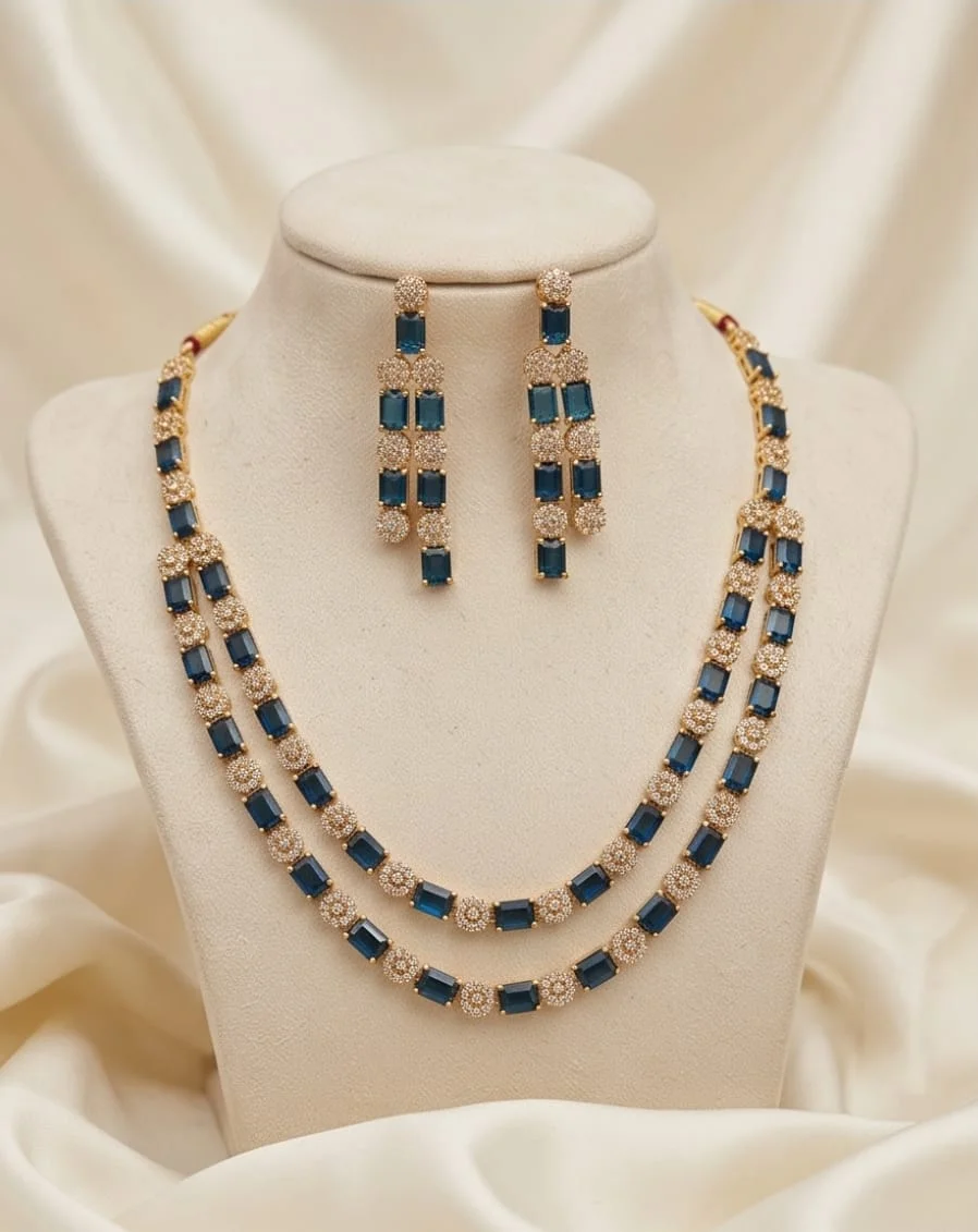 This Is A Gold-Plated Layered Necklace And Matching Earring Set Featuring Vibrant Emerald-Cut Navy Blue Stones alternate view